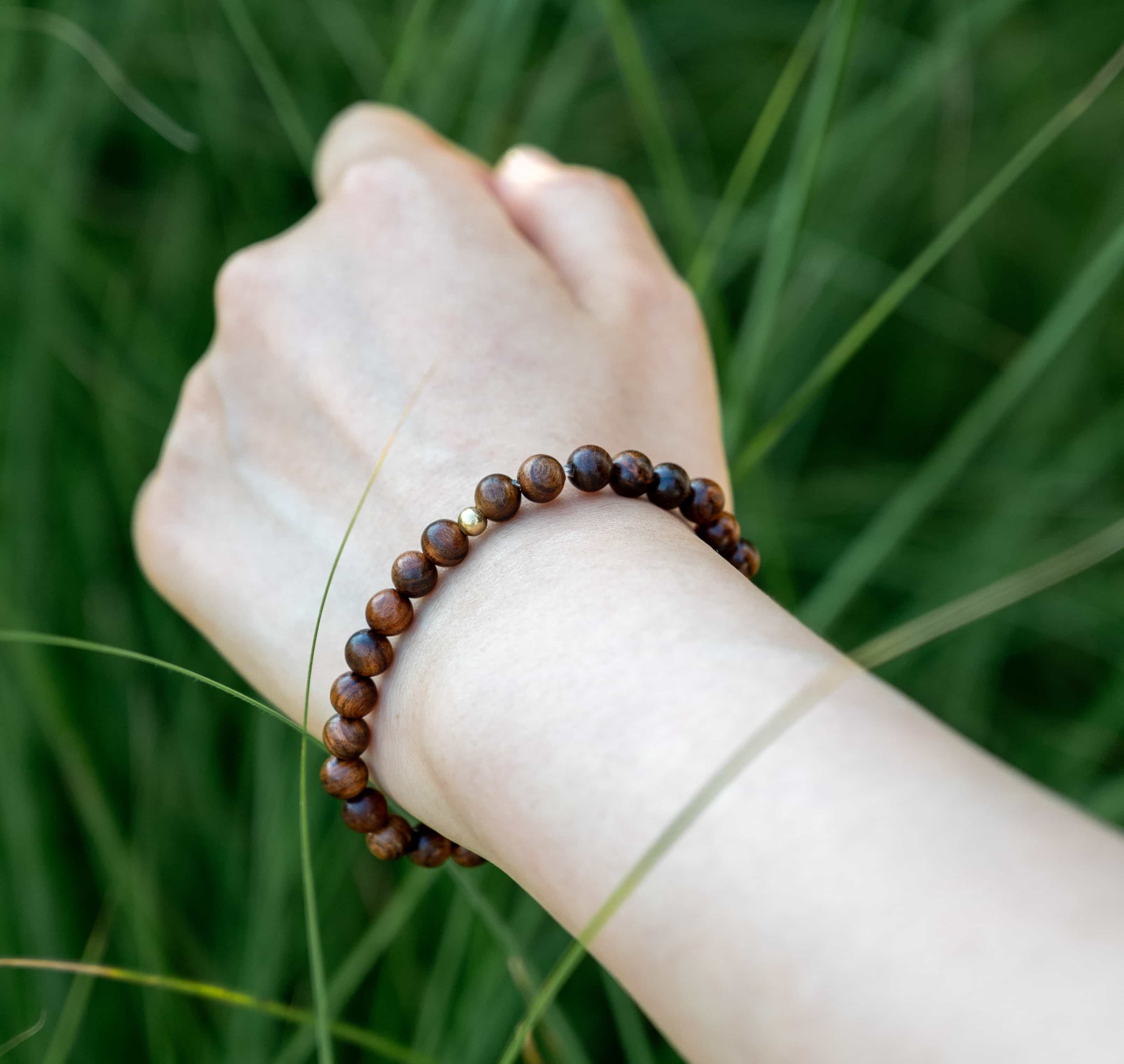 ROYAL CONFIDENCE: Agarwood Beads Bracelet with Gold Center Stone