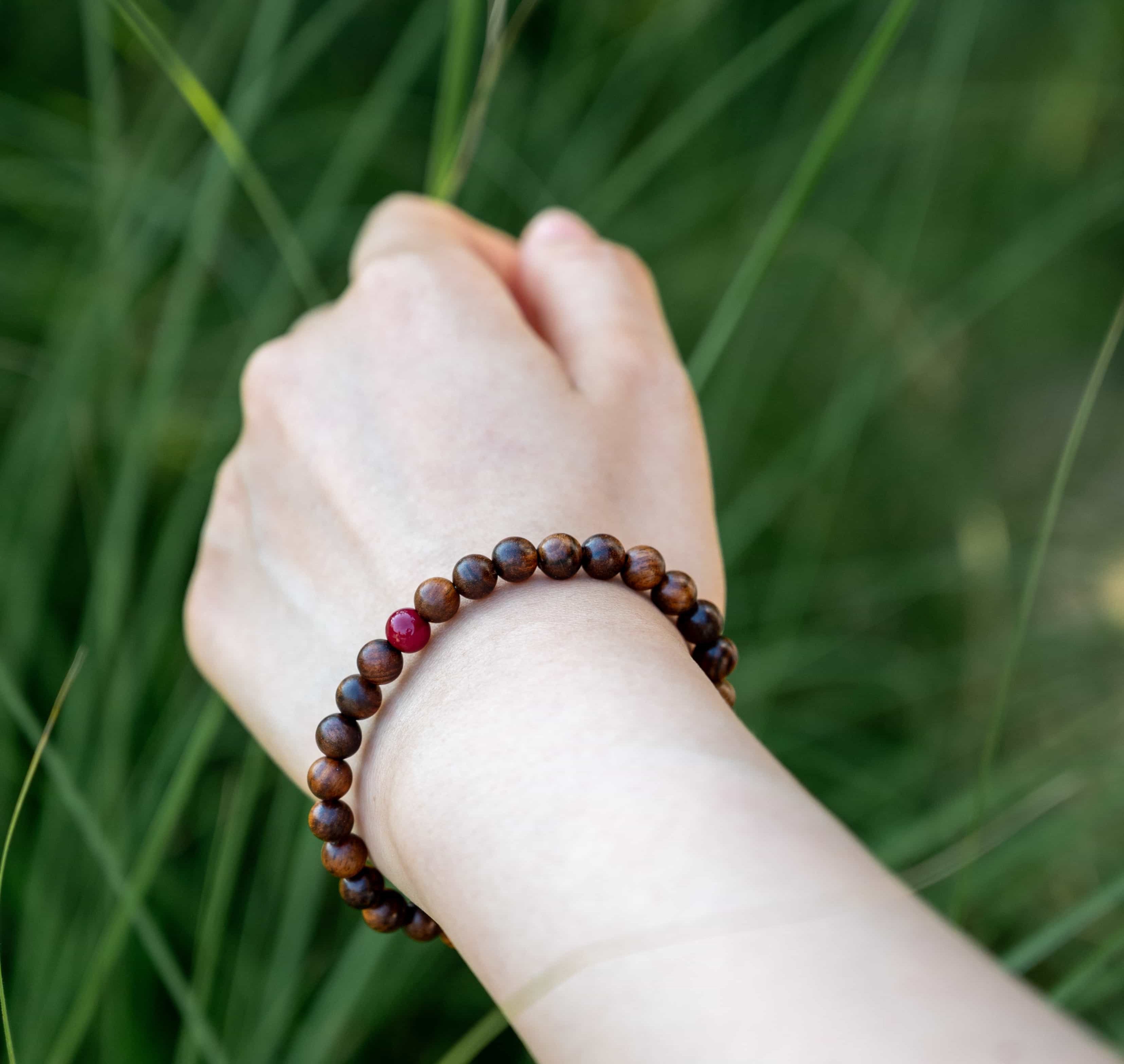 UNLIMITED PROSPERITY: Agarwood Beads Bracelet with Southern Red Agate Center Stone