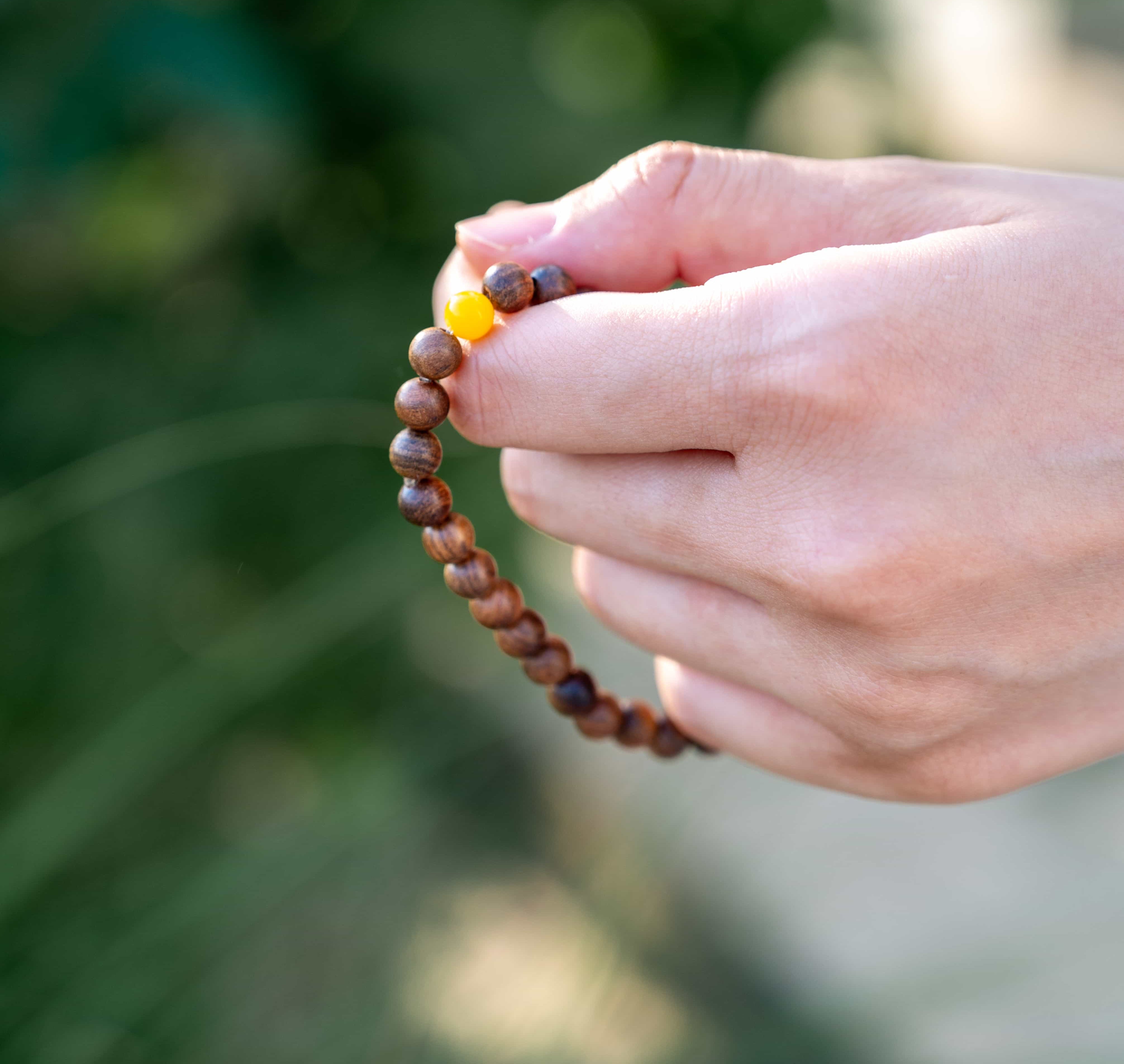 INNER STRENGTH: Agarwood Beads Bracelet with Honey Yellow Amber Center Stone