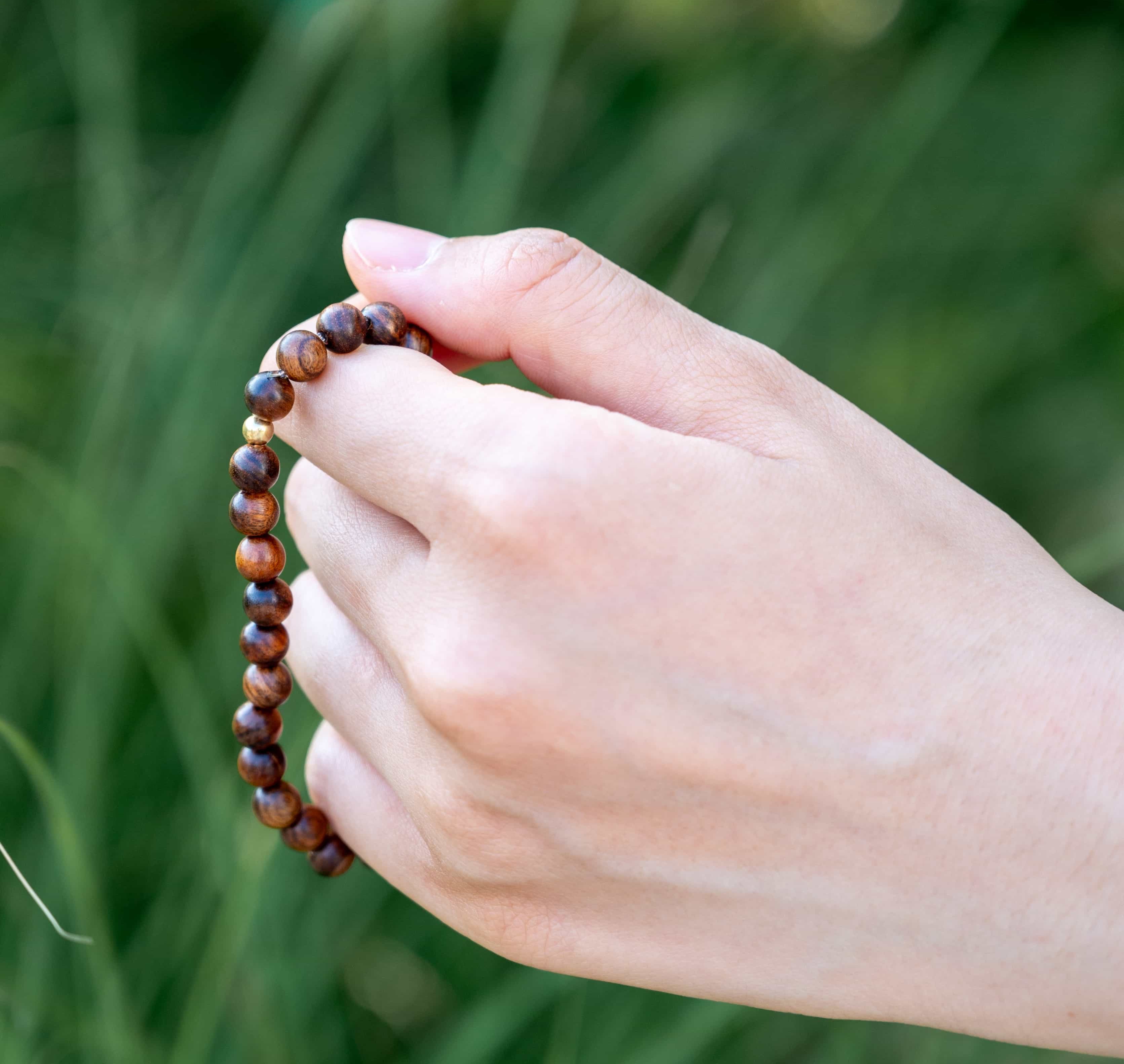 ROYAL CONFIDENCE: Agarwood Beads Bracelet with Gold Center Stone