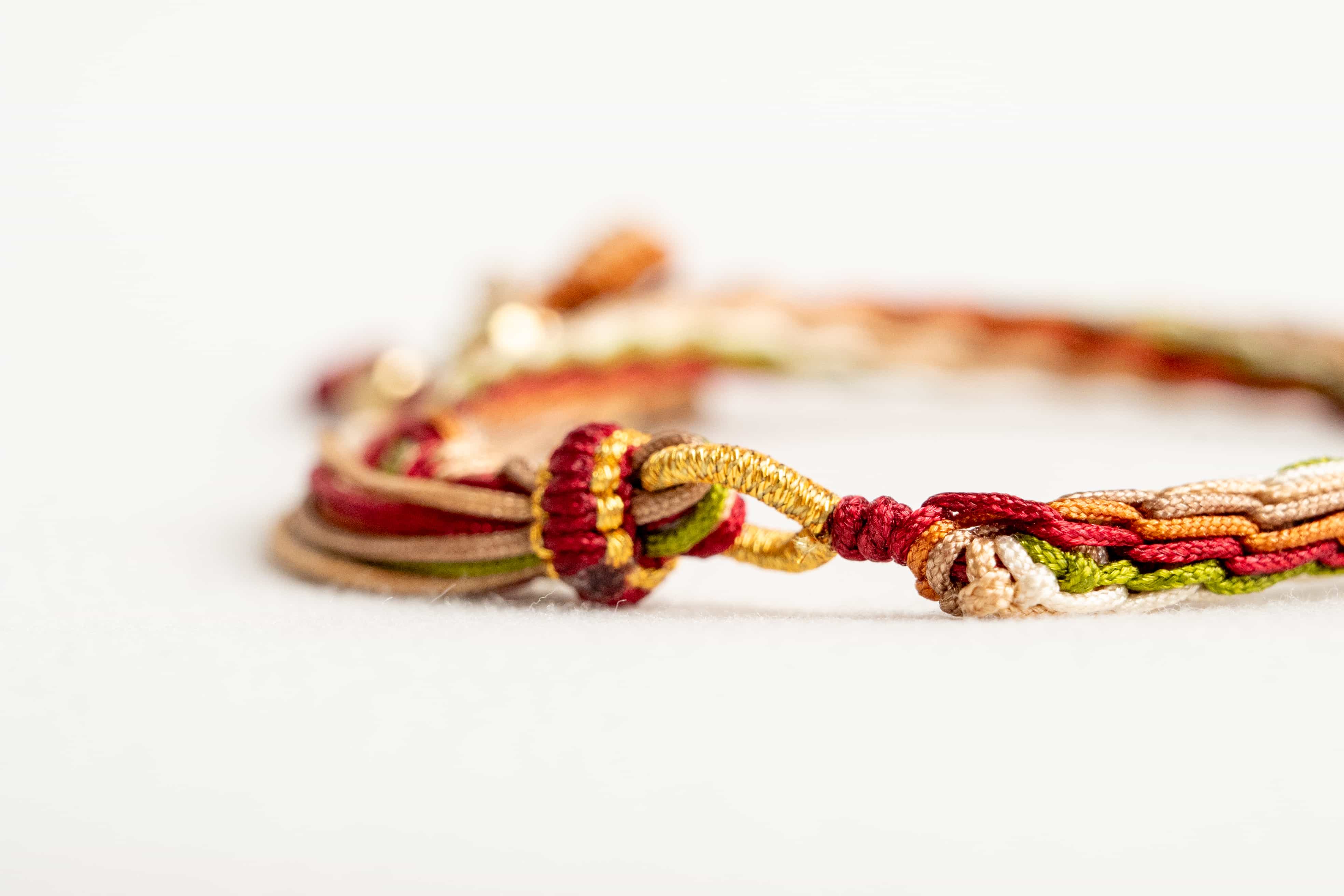 "MAJOR SNOW": Red & Yellow Handmade Braided Bracelet for Healing