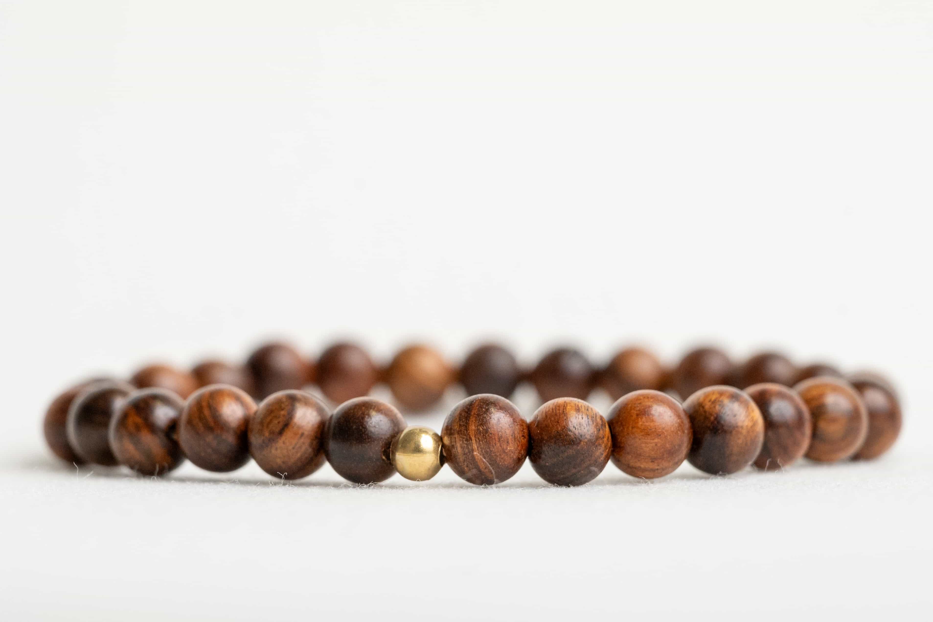 ROYAL CONFIDENCE: Agarwood Beads Bracelet with Gold Center Stone