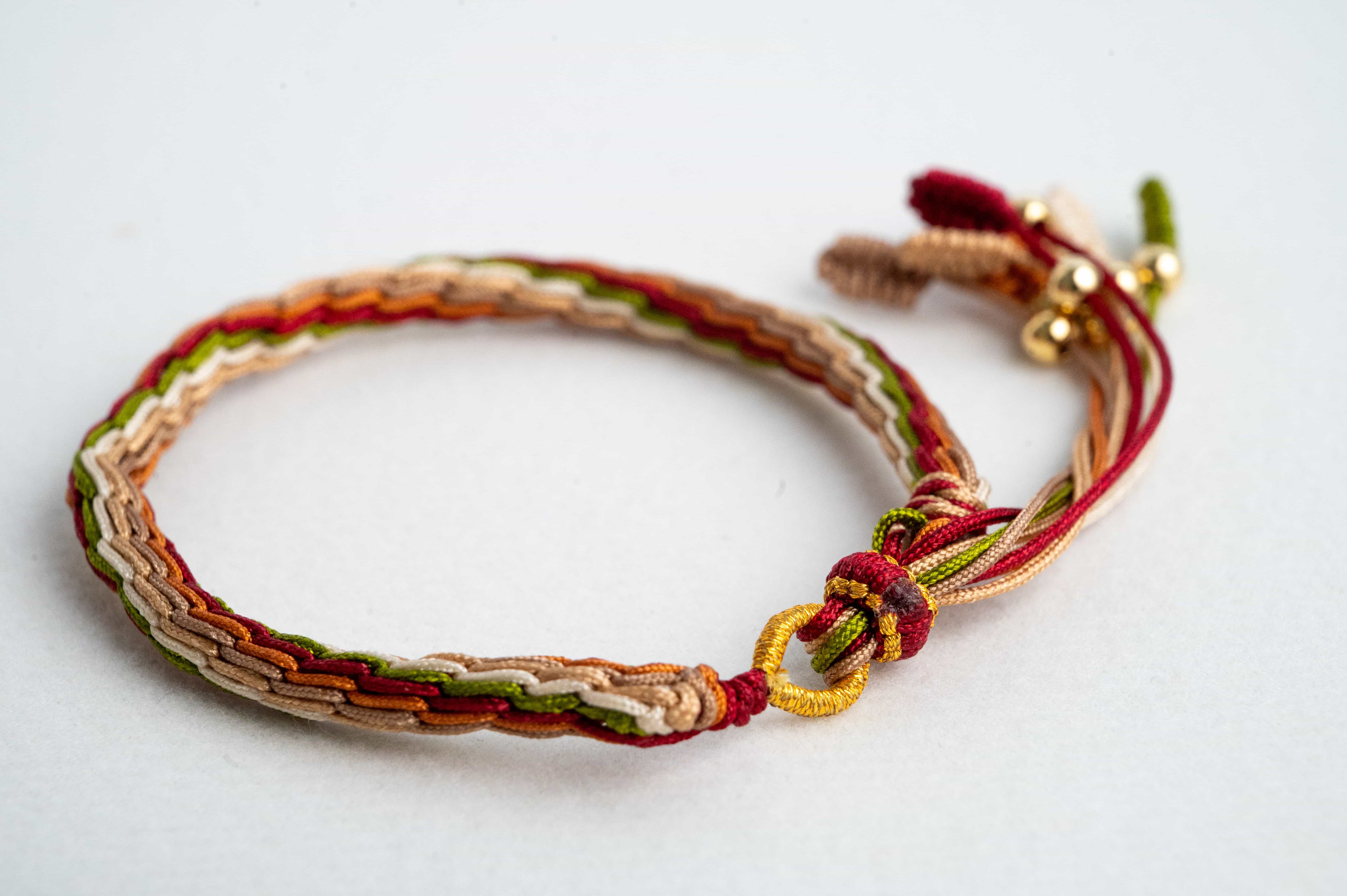 "MAJOR SNOW": Red & Yellow Handmade Braided Bracelet for Healing