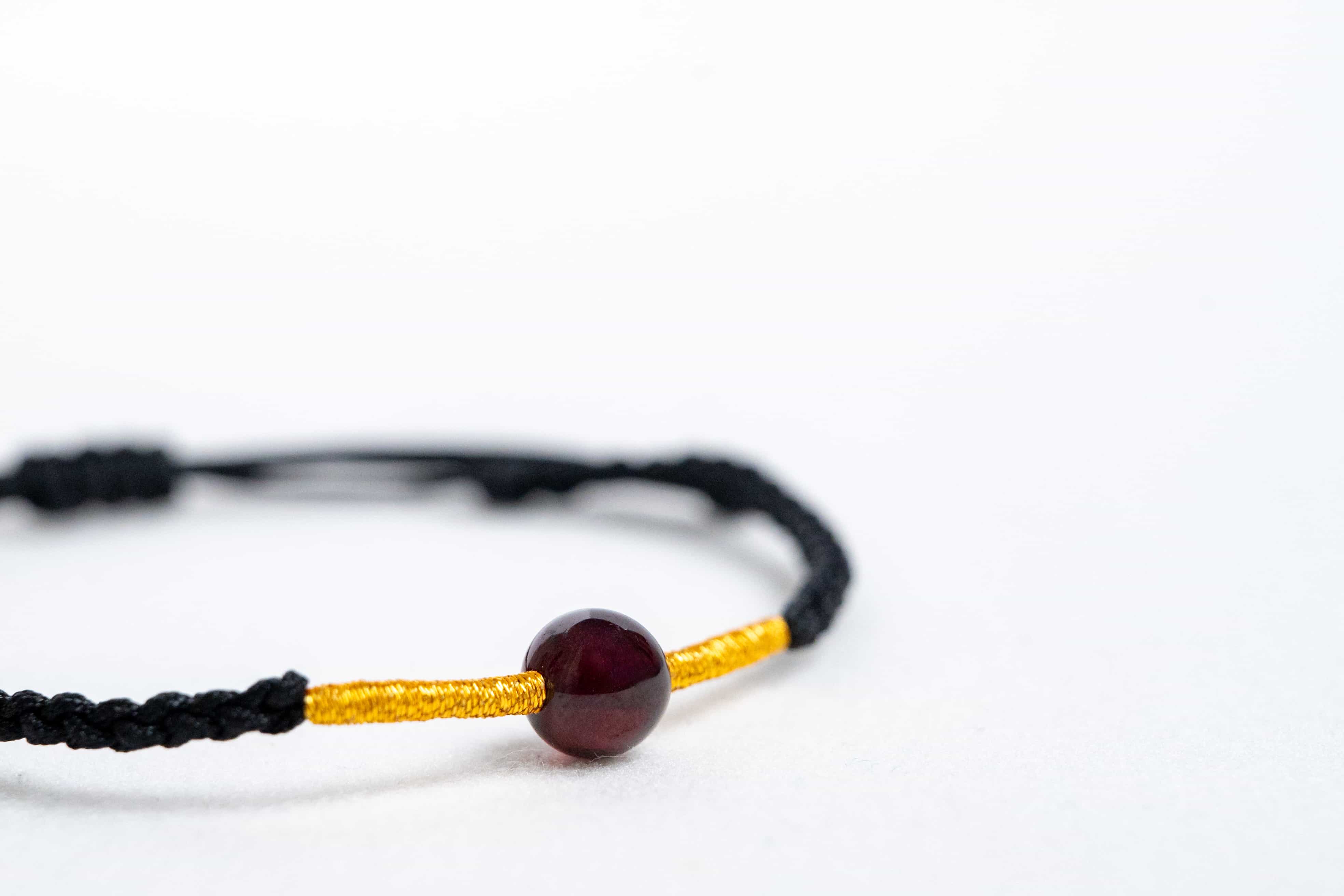 FIRE: Garnet Bead Black & Gold Braided Bracelet