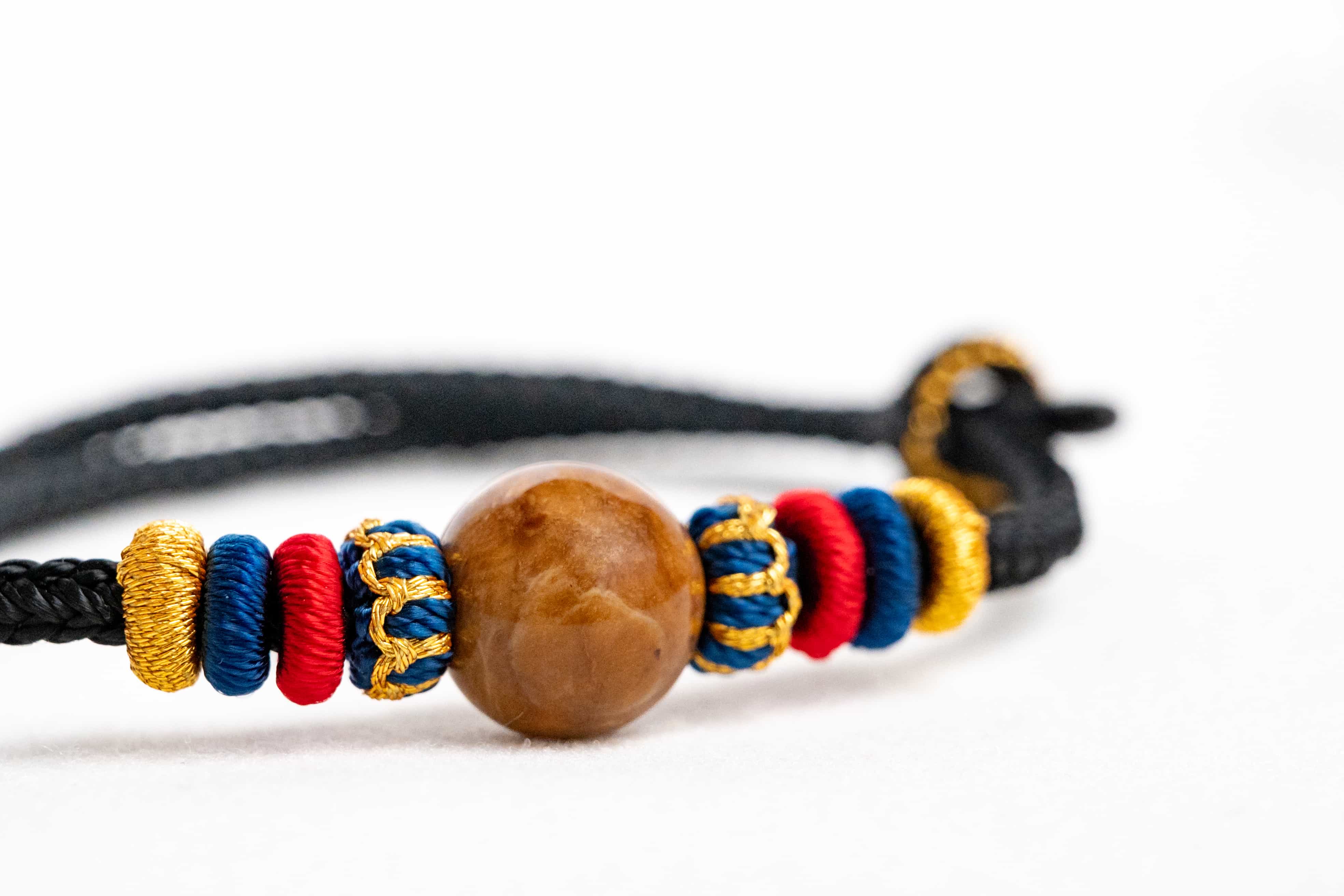 OMNI ENERGY: Pure Amber Braided Bracelet with Lucky Knots