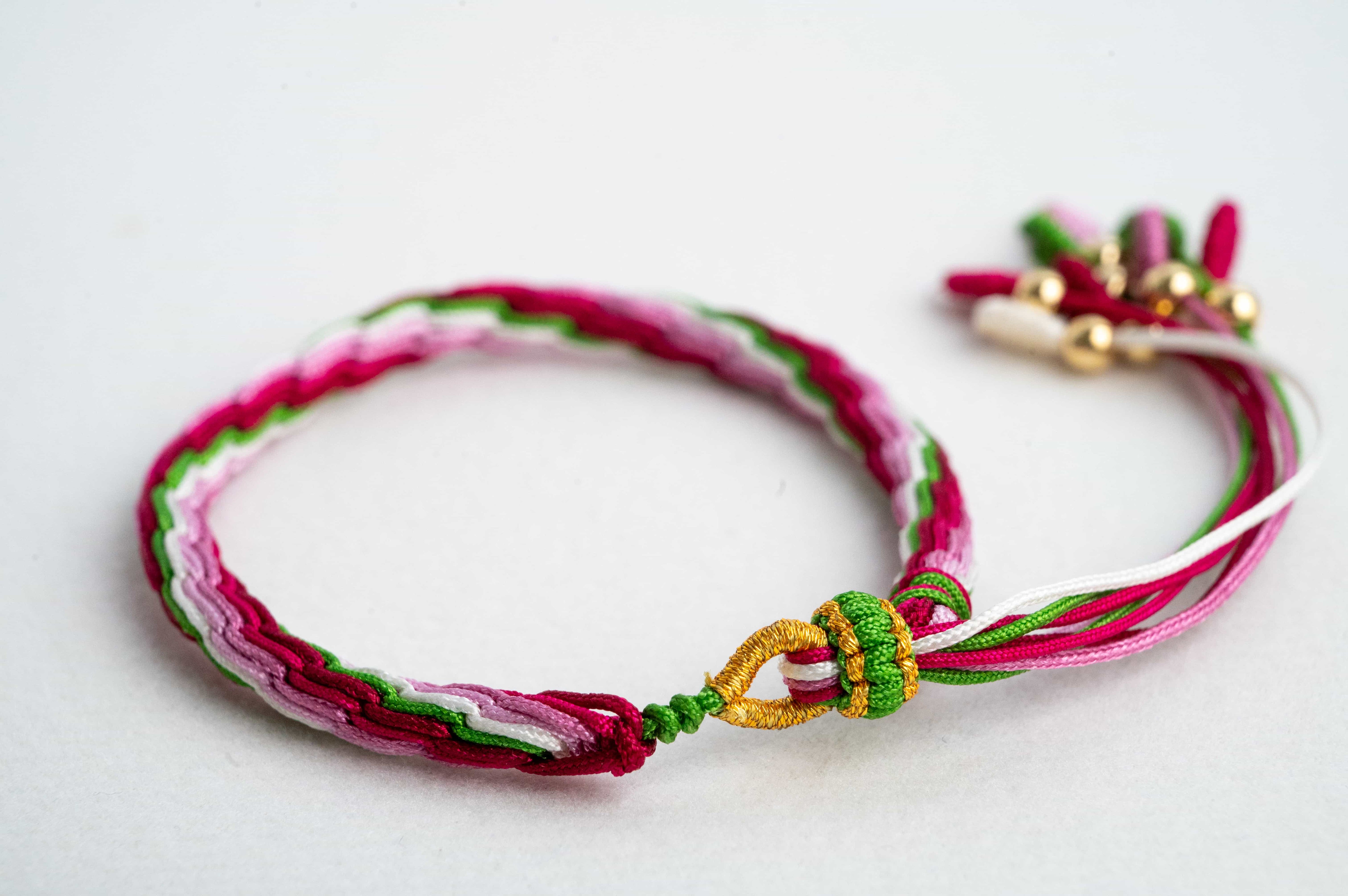 "GRAIN RAIN": Pink and Red Handmade Braided Bracelet for Growth