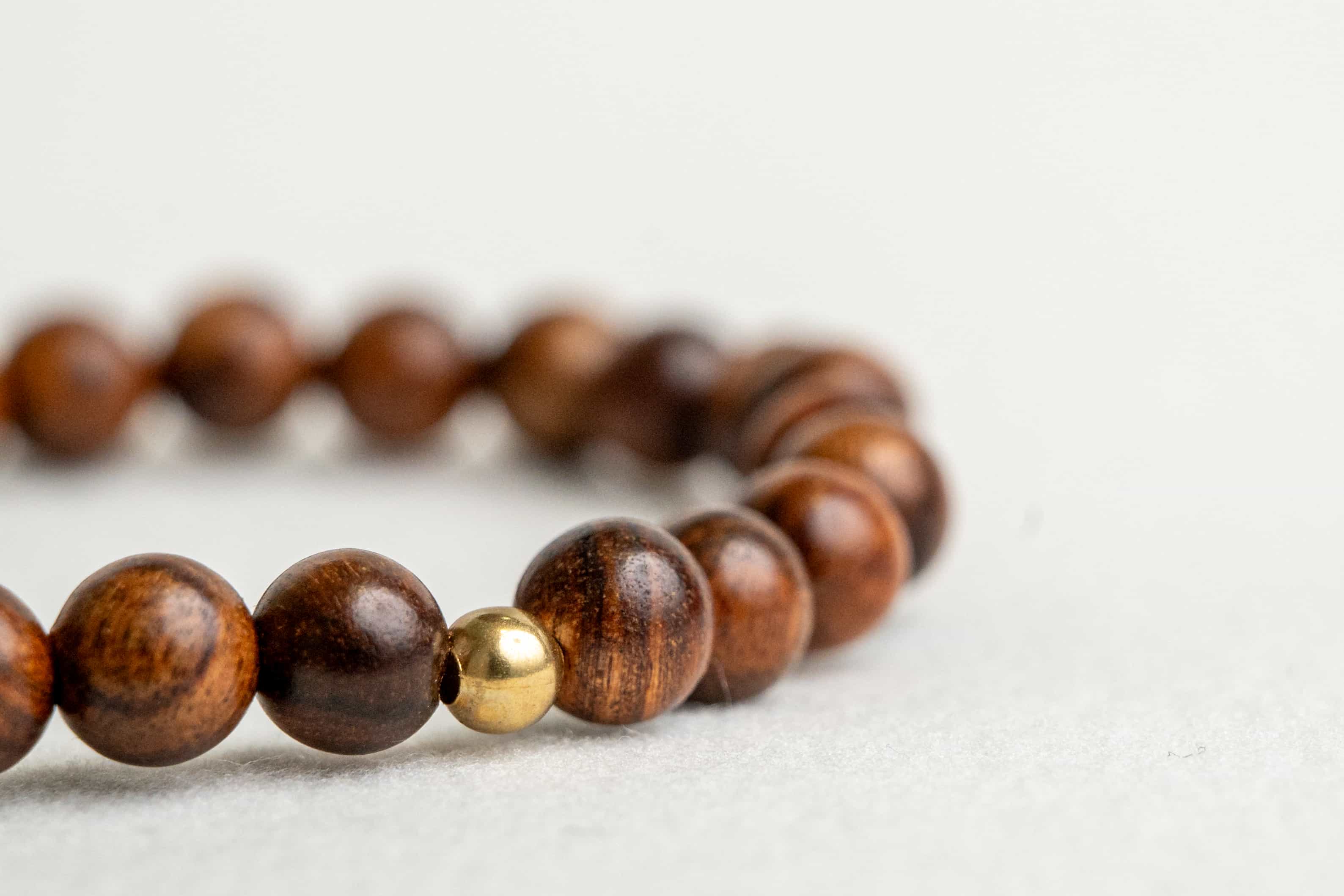 ROYAL CONFIDENCE: Agarwood Beads Bracelet with Gold Center Stone