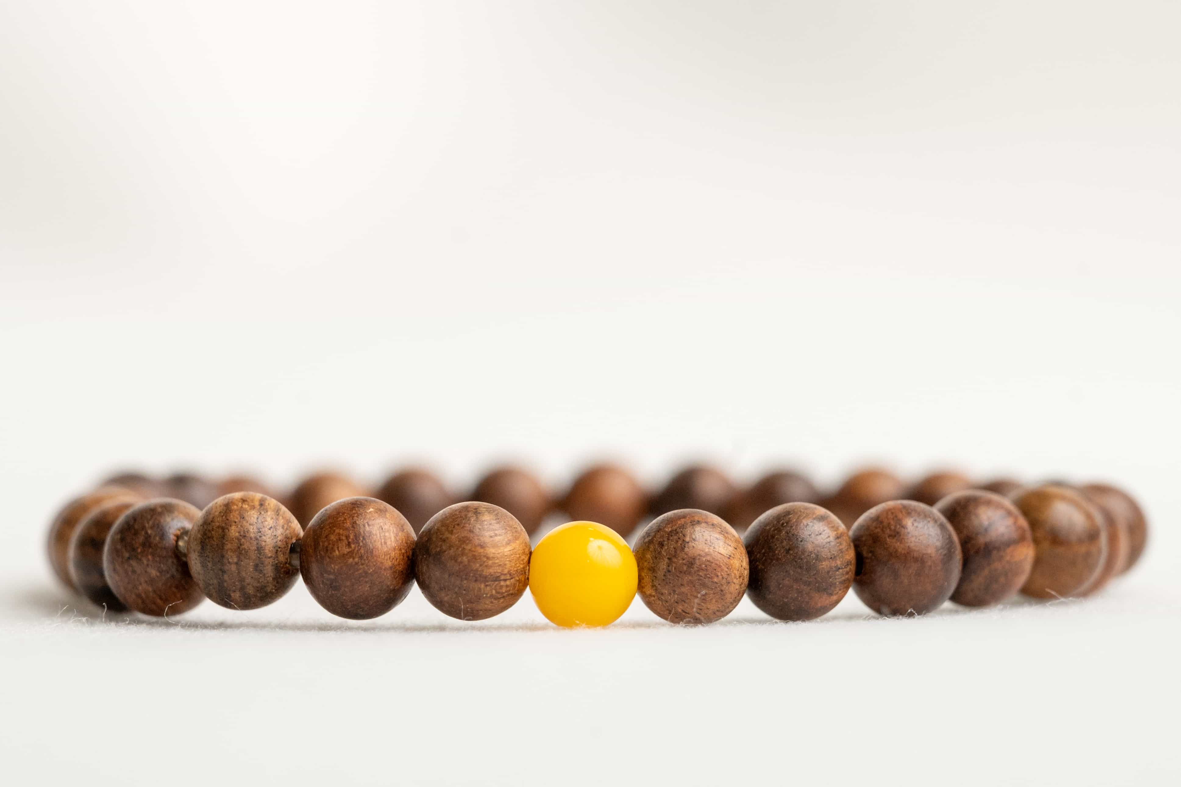 INNER STRENGTH: Agarwood Beads Bracelet with Honey Yellow Amber Center Stone