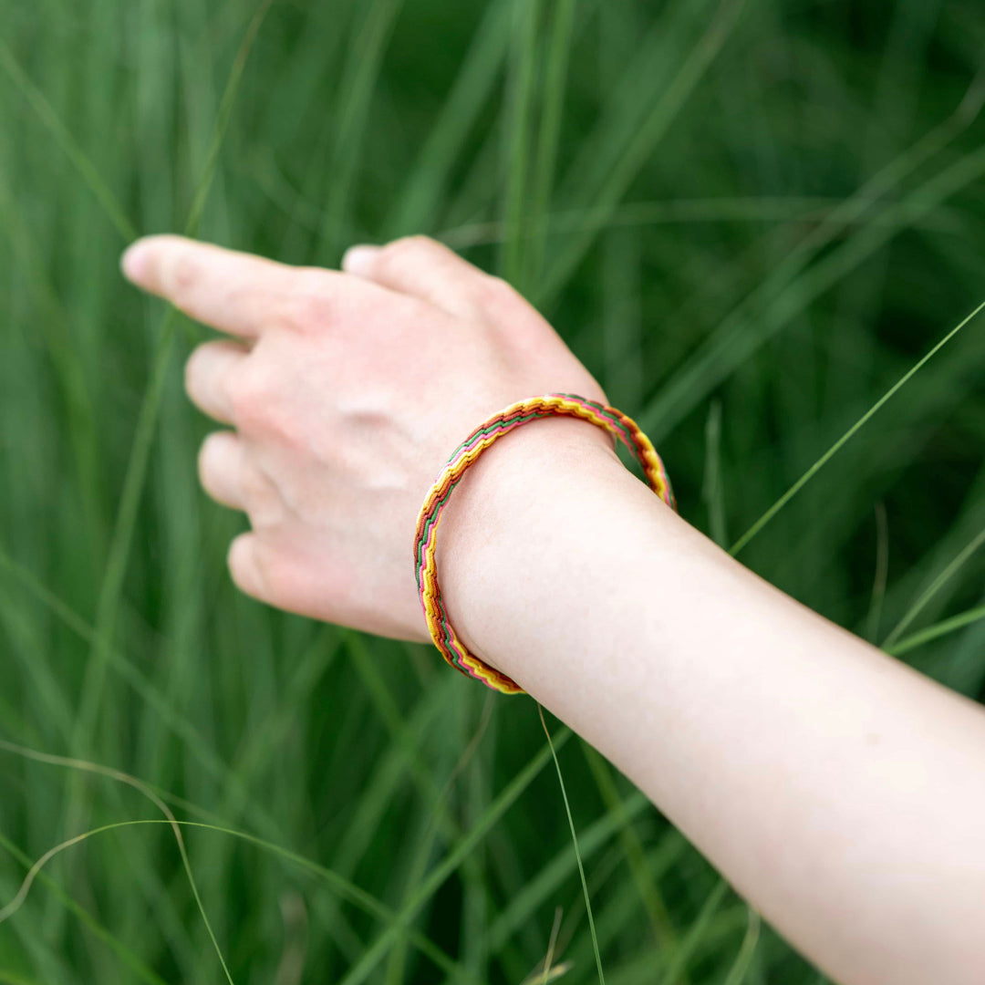 "MAJOR SNOW": Red & Yellow Handmade Braided Bracelet for Healing