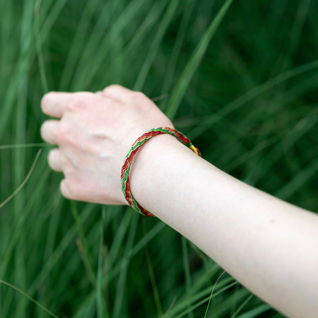 "MINOR HEAT": Green, Beige & Red Handmade Braided Bracelet for Authenticity