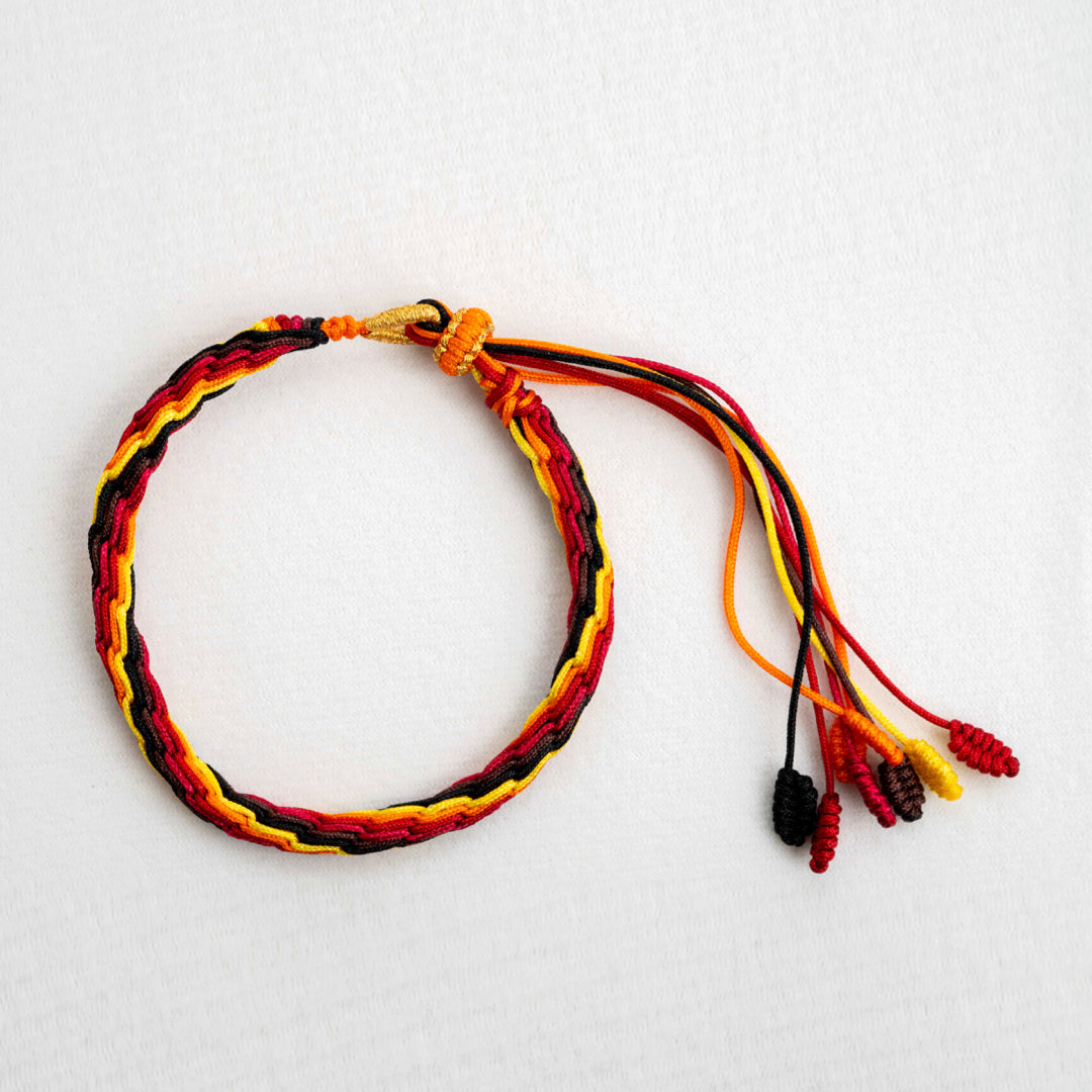 "WINTER SOLSTICE": Yellow and Red Handmade Braided Bracelet for Resilience