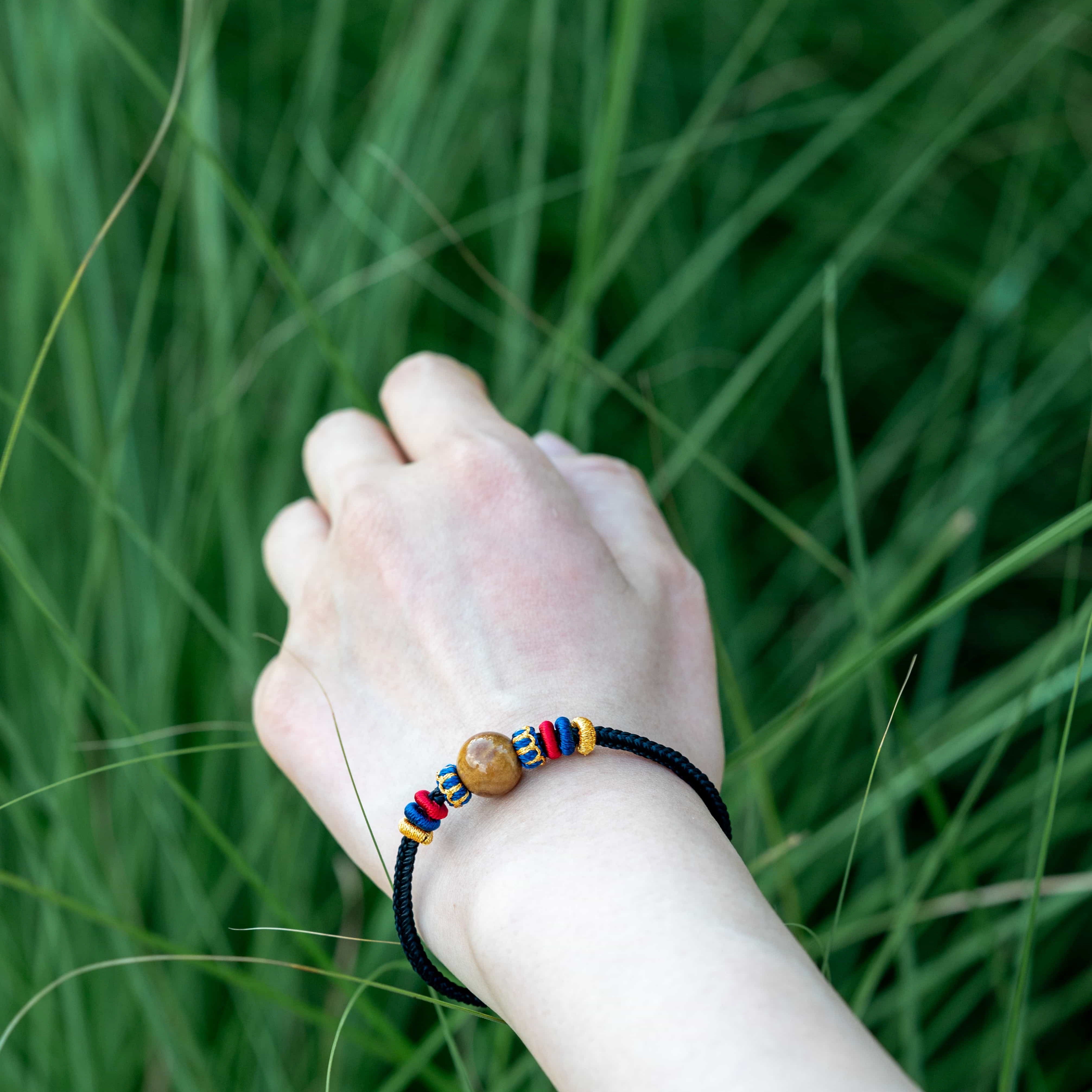 OMNI ENERGY: Pure Amber Braided Bracelet with Lucky Knots