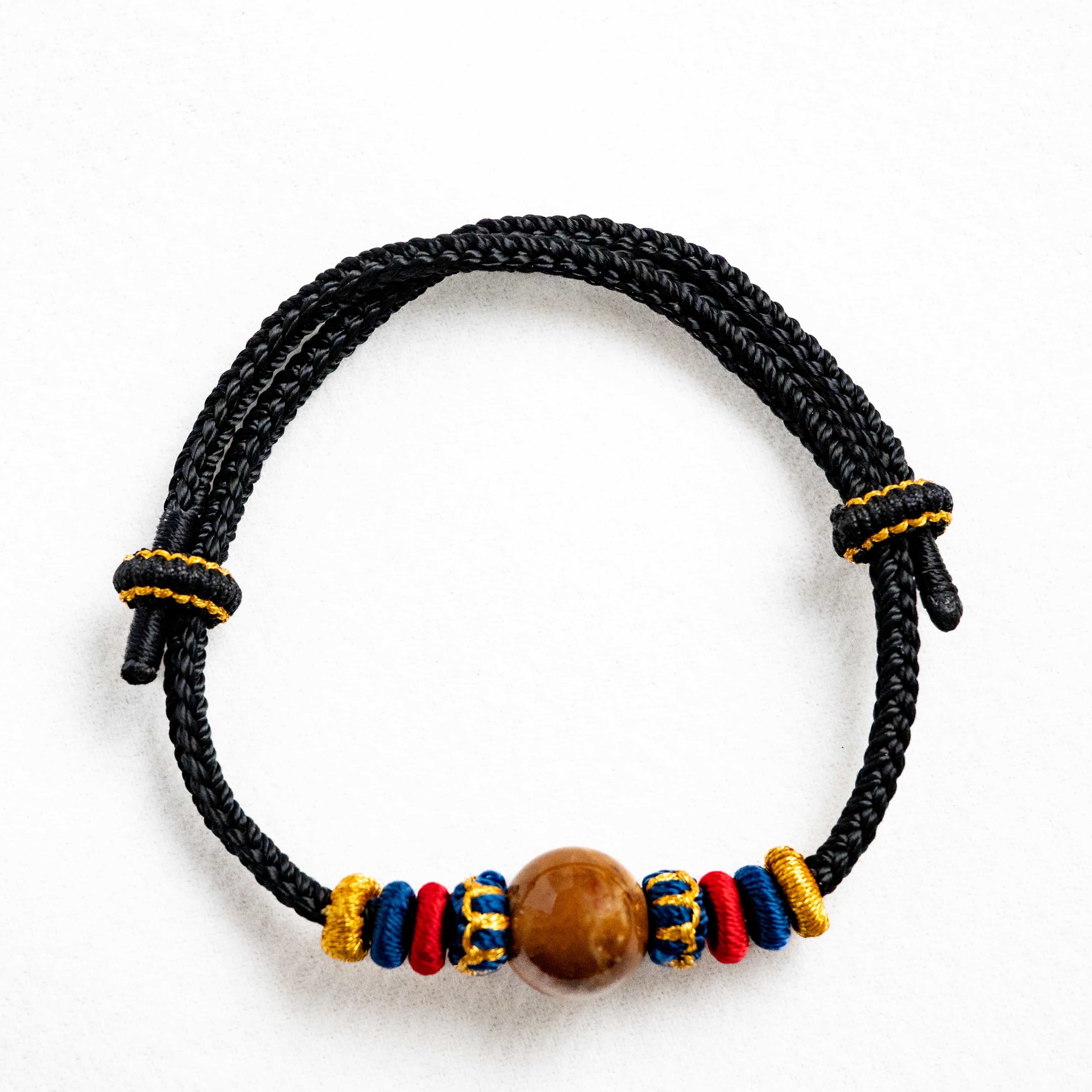 OMNI ENERGY: Pure Amber Braided Bracelet with Lucky Knots