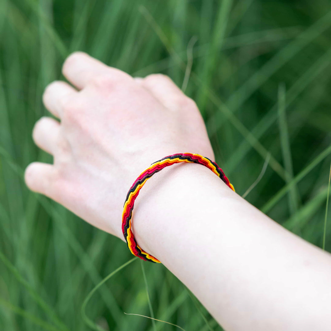 "WINTER SOLSTICE": Yellow and Red Handmade Braided Bracelet for Resilience