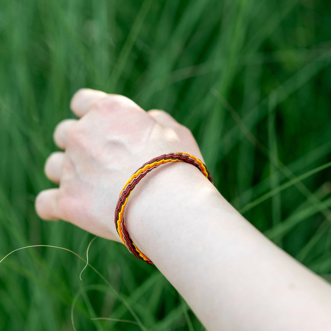 "MAJOR COLD": Yellow & Maroon Handmade Braided Bracelet for Inner Peace