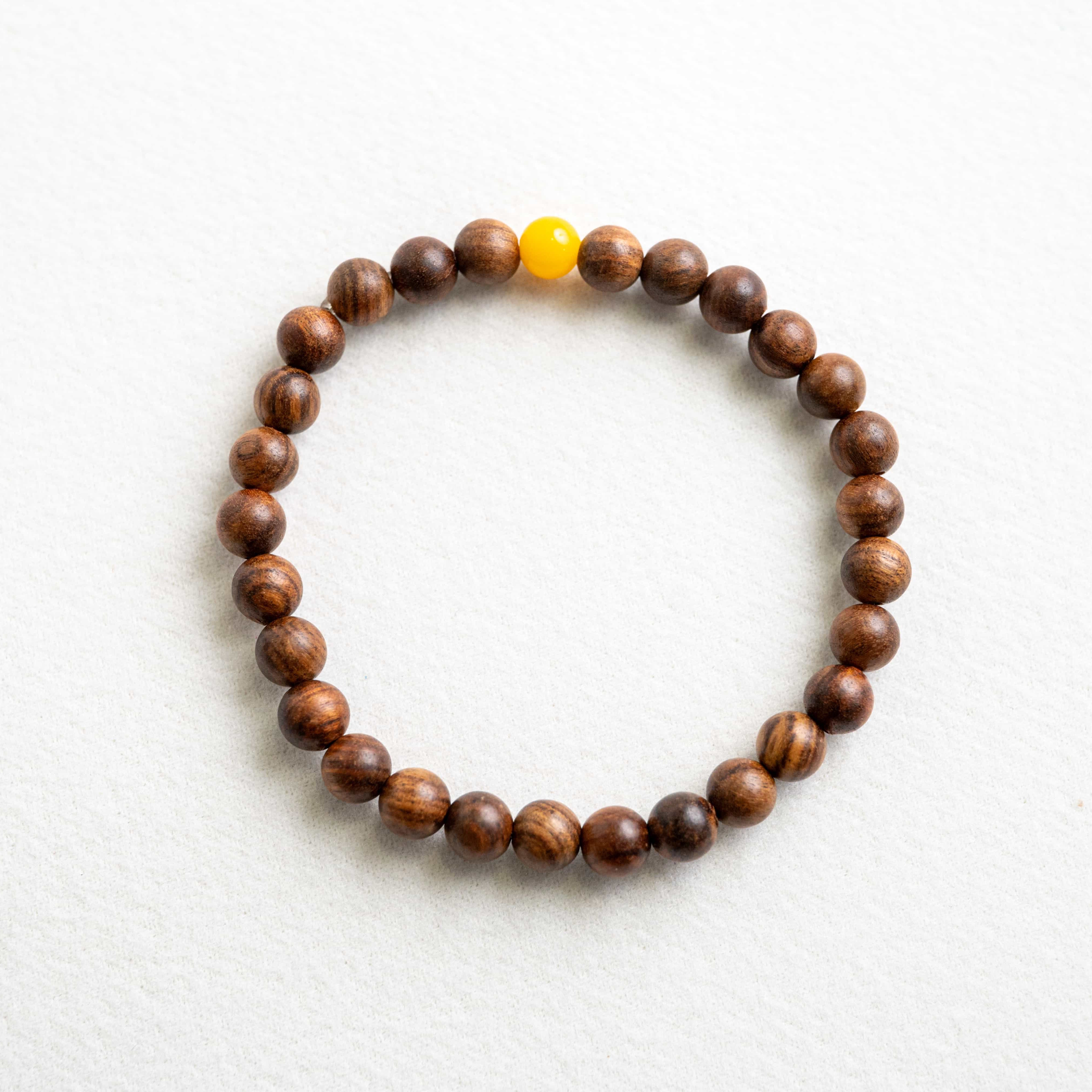 INNER STRENGTH: Agarwood Beads Bracelet with Honey Yellow Amber Center Stone