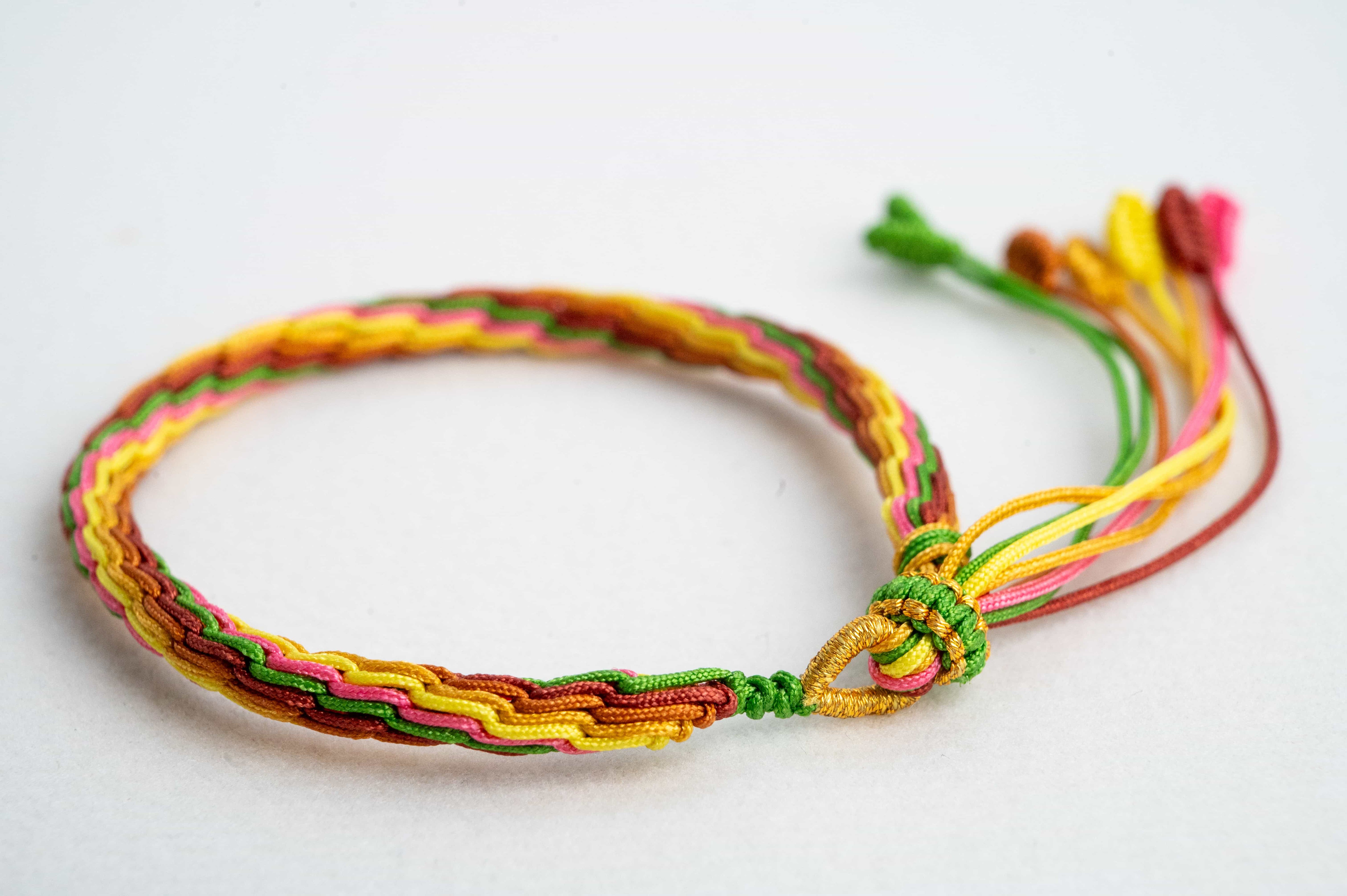 "MAJOR HEAT": Green, Yellow & Brown Handmade Braided Bracelet for Passion